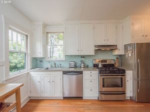 kitchen interior wood floors stainless steel appliances