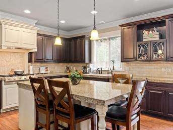 Kitchen with granite tile island and counters