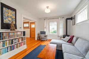 Interior living room wood floors couch book shelf stove