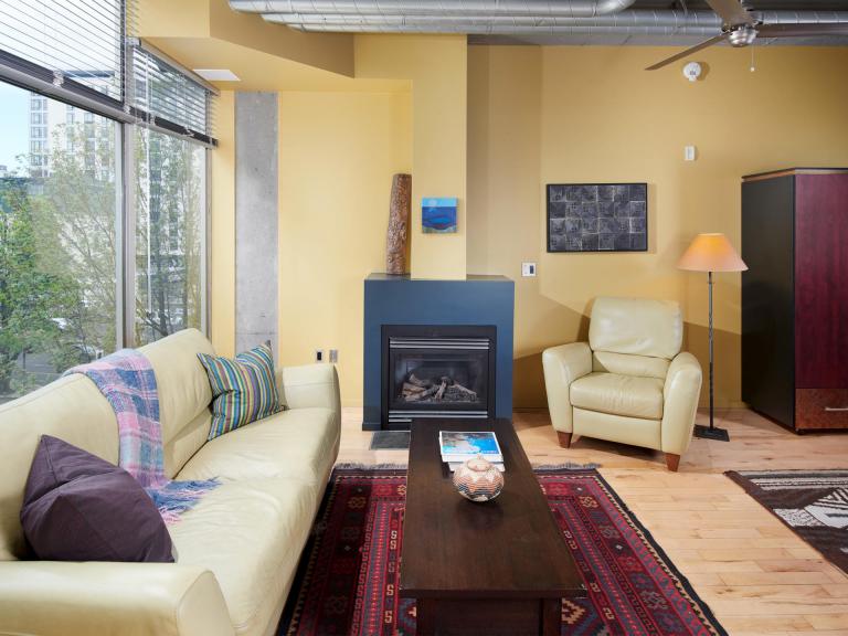 Interior Mosaic condo for sale downtown PDX floor to ceiling windows and fireplace