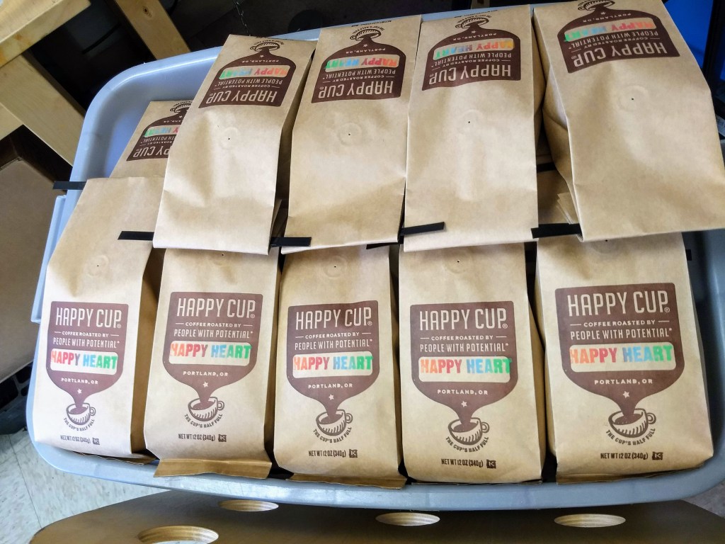 Happy Cup Coffee Company bin of of Happy Heart Coffee bags