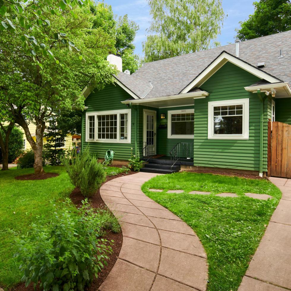 Exterior of Craftsman home in Eastmoreland Portland, green grass, walkway to front door
