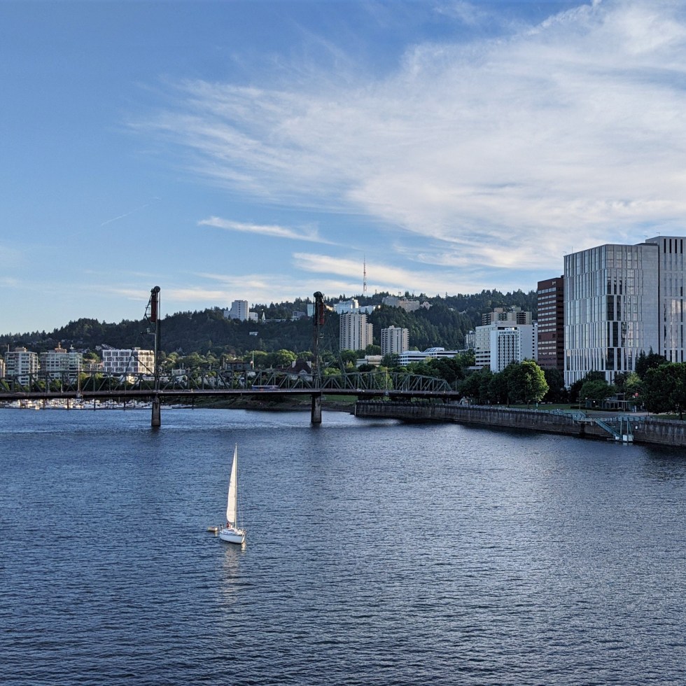 Willamette River with buildings and bridge in the distance