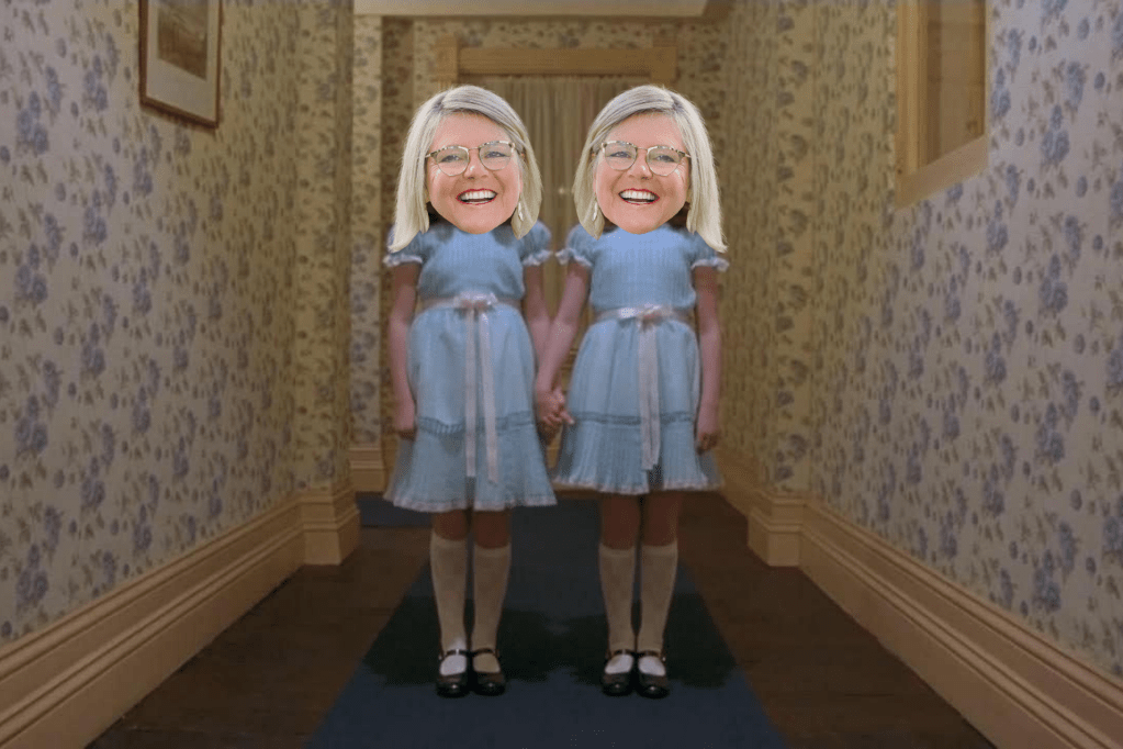 Twins from The Shining movie in matching blue dresses and knee socks with Susie's face on each one's head