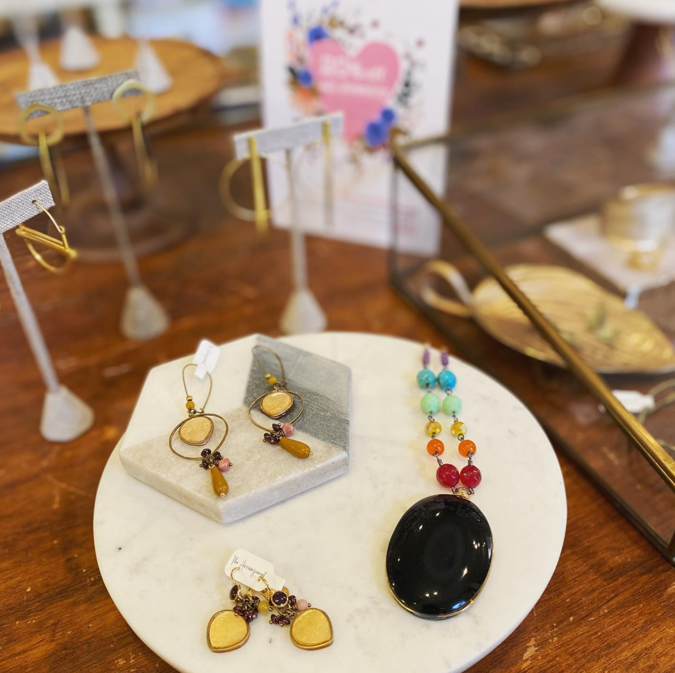 Earring and necklace with black stone on a table