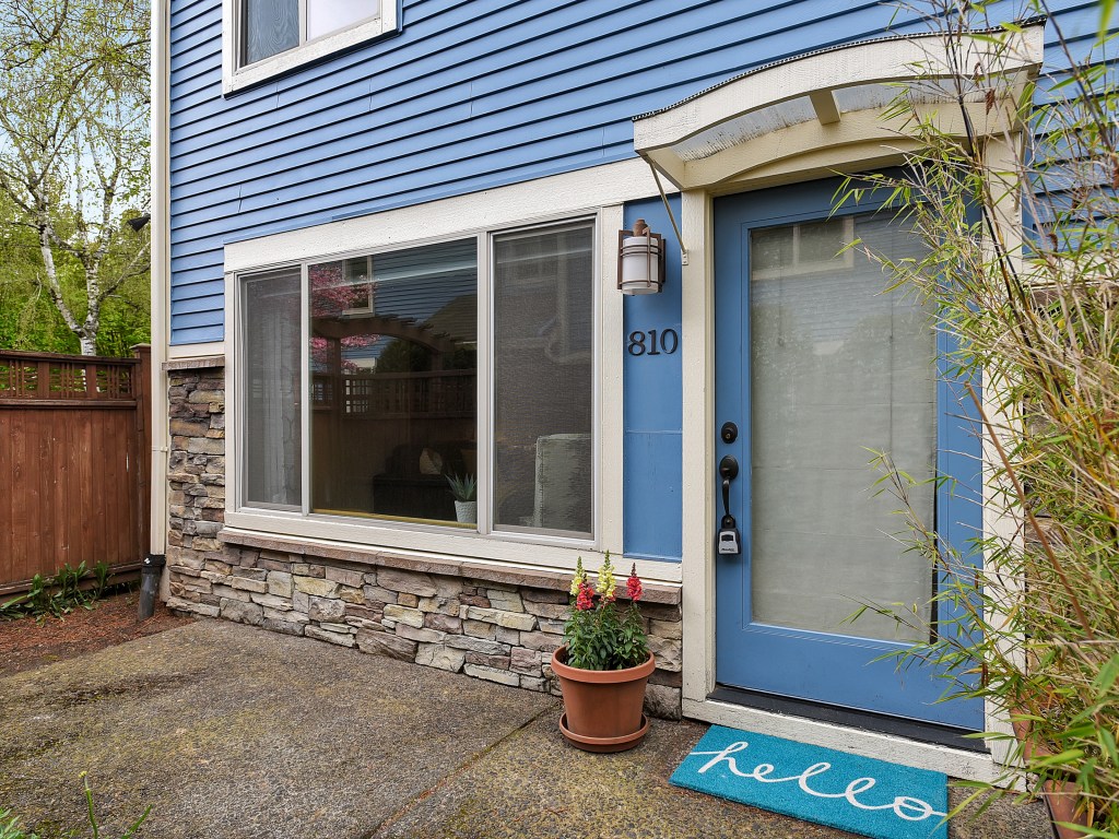 Exterior of condo with window on left, door on right