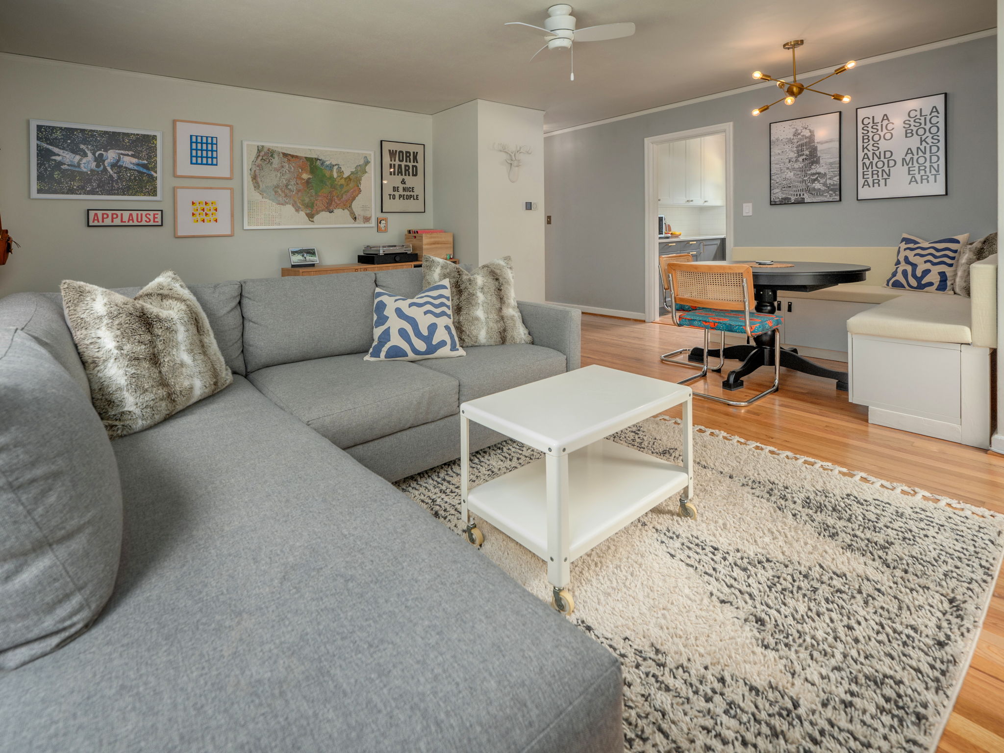 Living room w wood floors and dining area