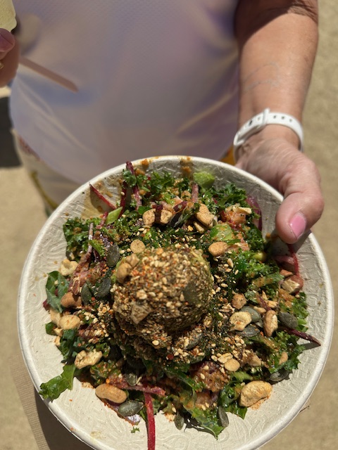 Woman's hand holding a poke bowl
