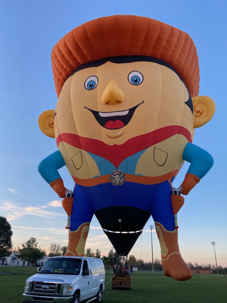 Large hot air balloon designed to look like a cowboy