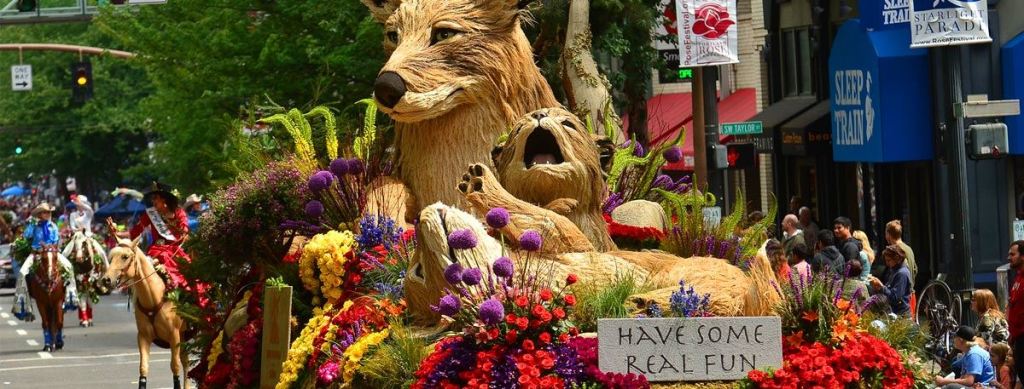 A float covered in flowers and an animal design at the Rose Parade